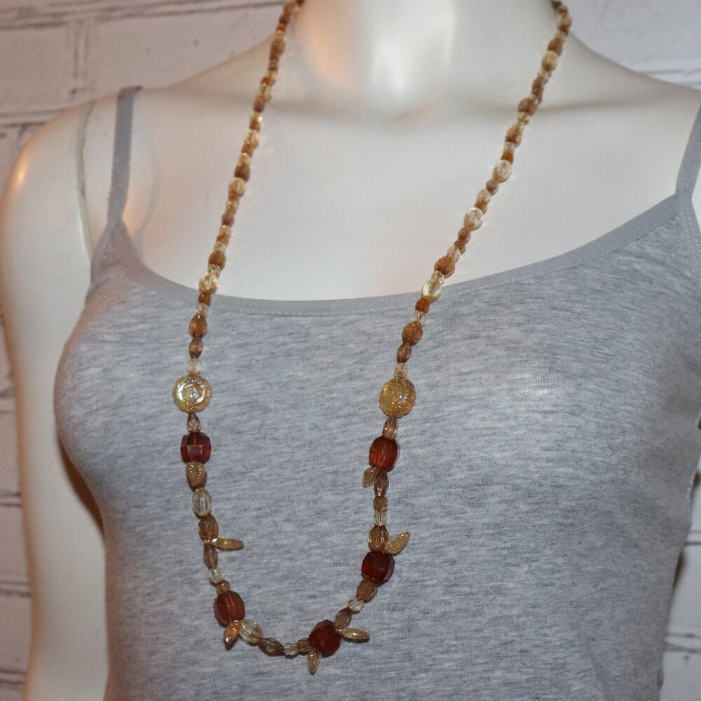 Beautiful brown and tan beaded necklace with leaf charms 34"